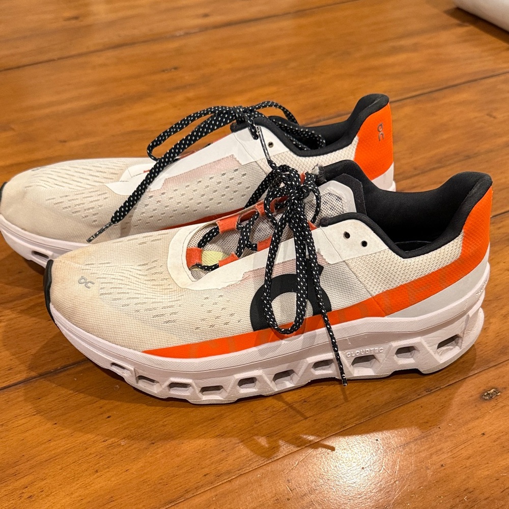 On Running Cream and Orange Sneakers